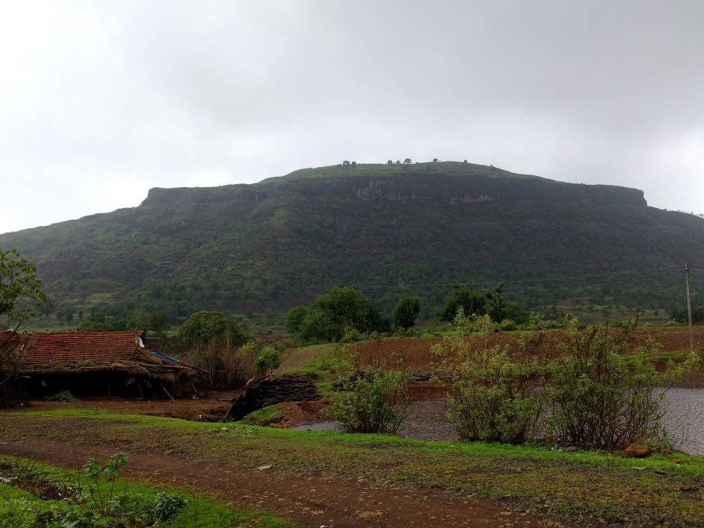 Scenic view of Tringalwadi Fort near Rainyresort, surrounded by lush greenery.